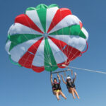 Parasailing in Marina di Pisticci with scenic boat tour and thrilling flight over the sea